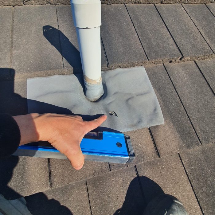 Plumbing vent pipe flashing inspection on shingle roof
