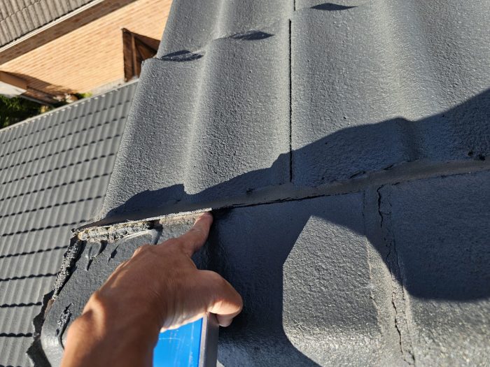Cracked ridge capping pointing on tile roof Sydney