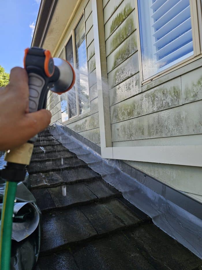 Hose spray test on roof flashing
